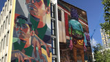 Bürogebäude im Münchner Süden mit Murals von Os Gêmeos und ARYZ 